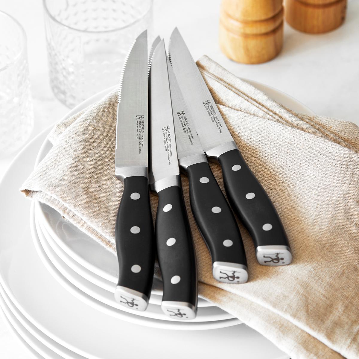 https://i03.hsncdn.com/is/image/HomeShoppingNetwork/rocs1200/henckels-international-4-piece-steak-set-black-handle-d-20220916090632367~20386856w_alt1.jpg