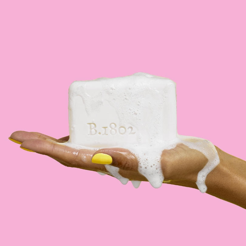 a woman's hand holding soap